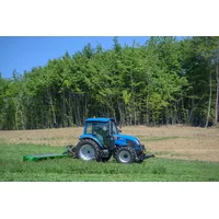 Text: Modern tractor on the lawn